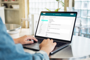 Man completing a health risk assessment on a laptop.