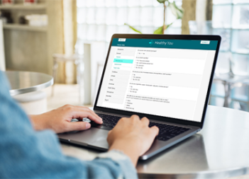 Man completing a health risk assessment on a laptop.