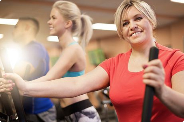 Women on an elliptical machine