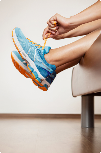 Tying shoes on a couch